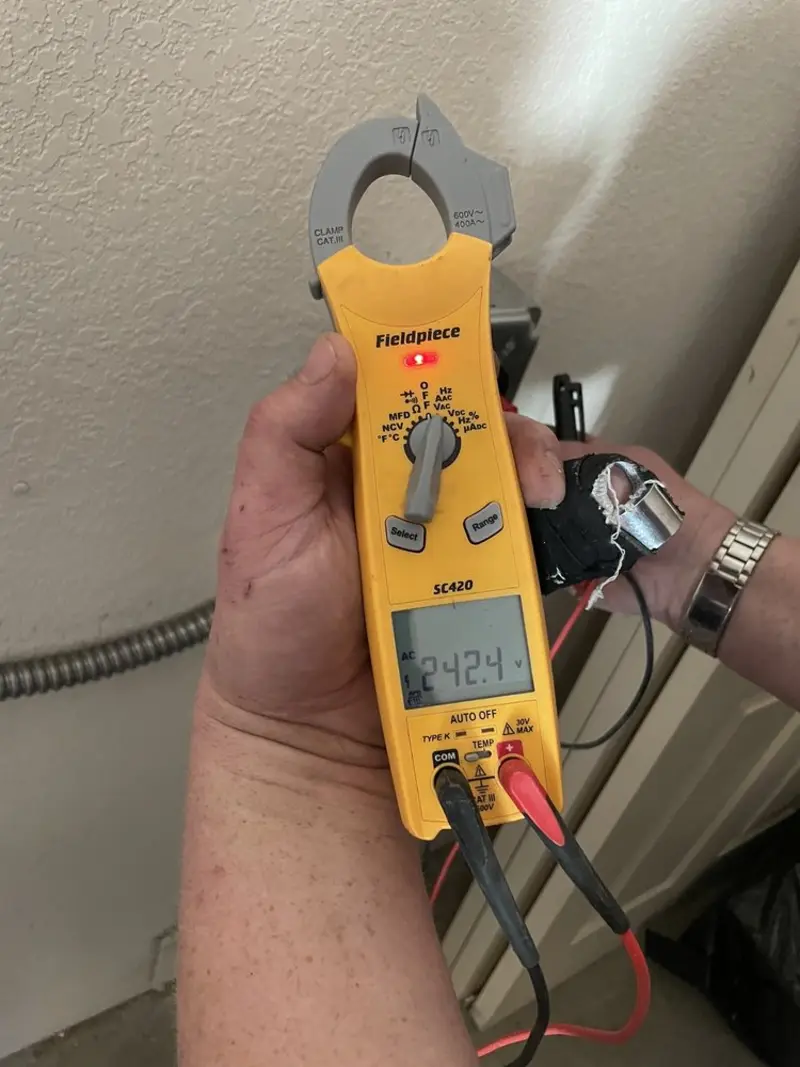 Voltage testing with clamp meter during Generator Installation in Topsfield